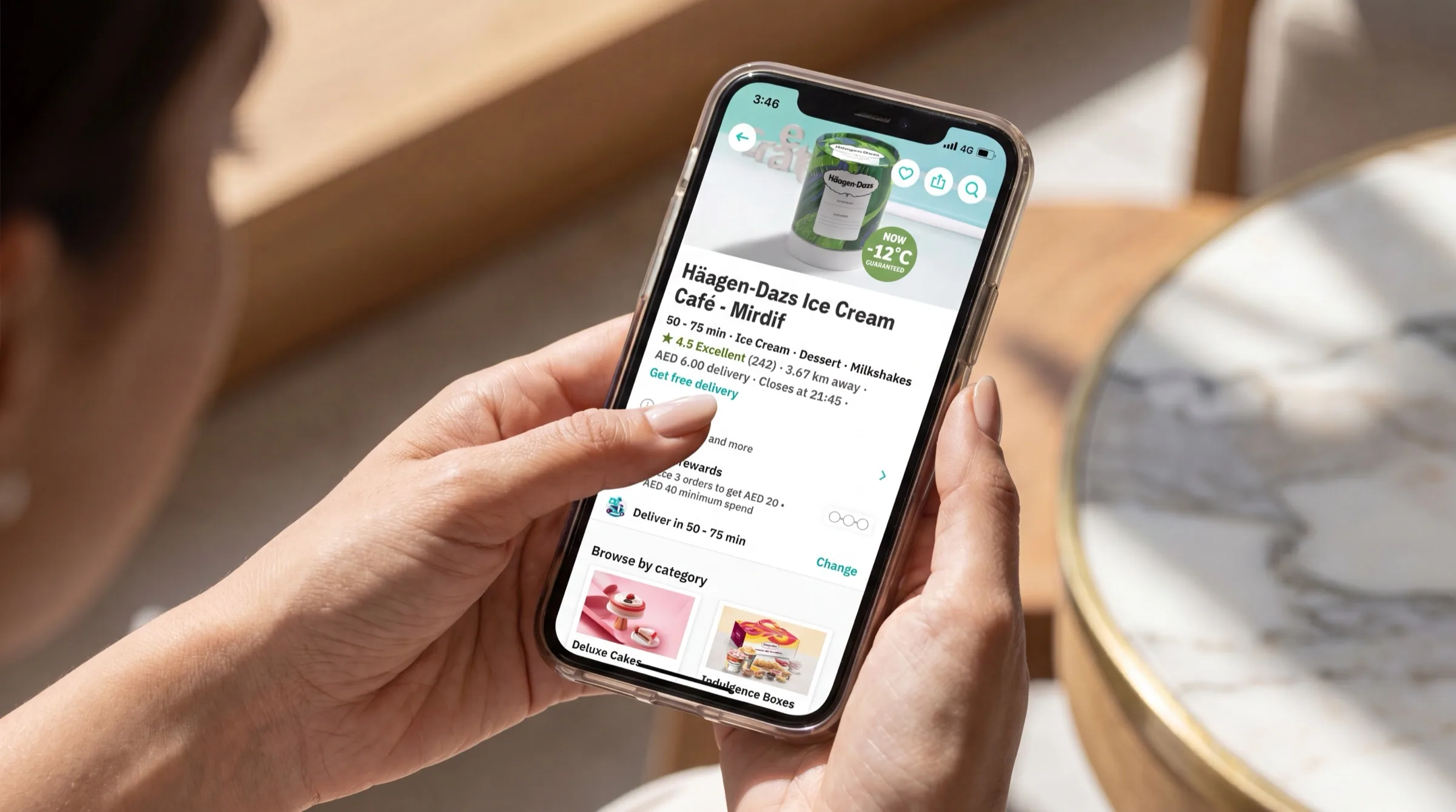 Häagen-Dazs product listing shown on a delivery app lifestyle mockup